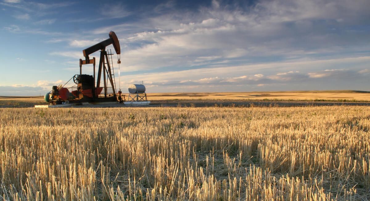 Oil derrick in a hayfield